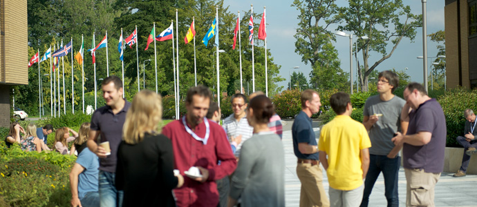 ECMWF staff outside with member states flags